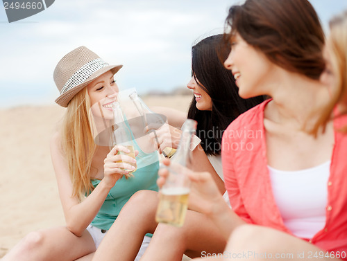 Image of girls with drinks on the beach