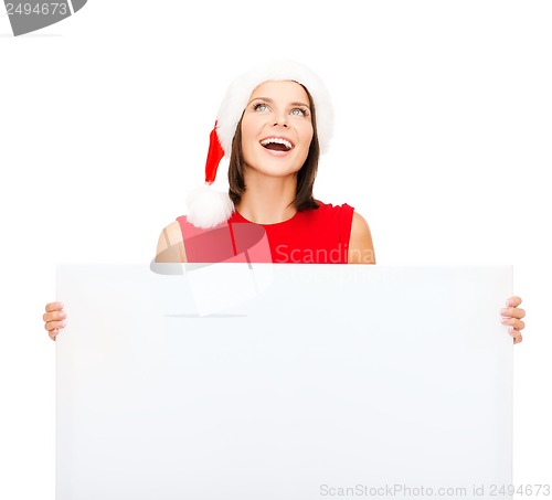 Image of woman in santa helper hat with blank white board