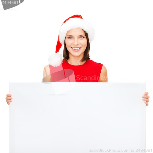 Image of woman in santa helper hat with blank white board