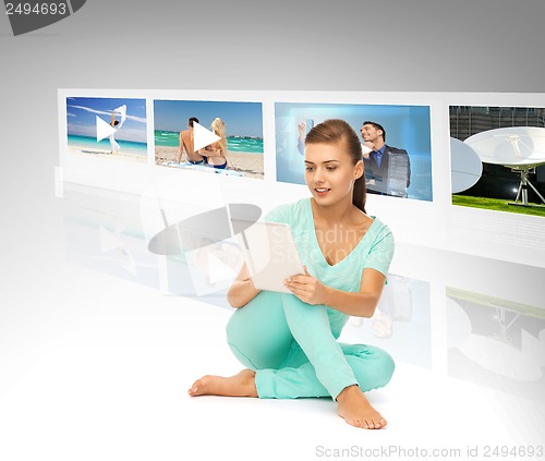 Image of woman with tablet pc and virtual screens