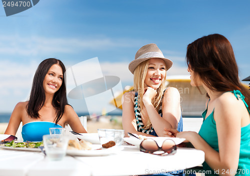 Image of girls in cafe on the beach