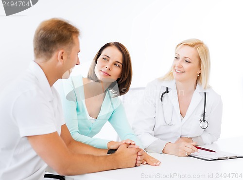 Image of doctor with patients in cabinet