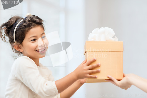 Image of happy child girl with gift box