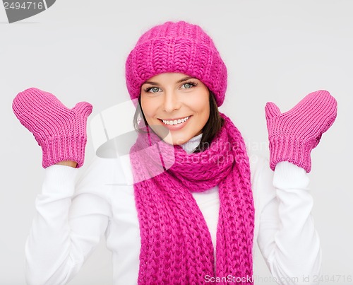 Image of woman in hat, muffler and mittens