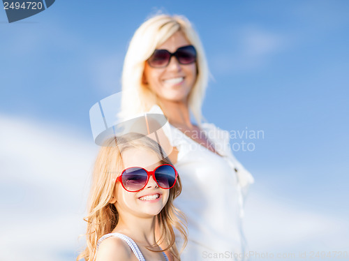 Image of mother and child in sunglasses
