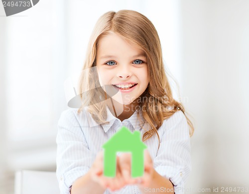 Image of girl holding green paper house