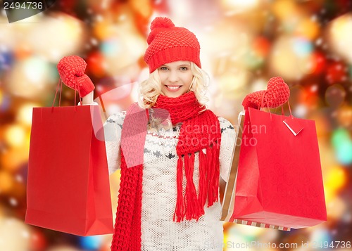 Image of teenage girl in winter clothes with shopping bags