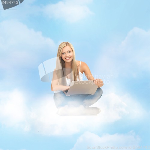 Image of woman sitting on the cloud with laptop