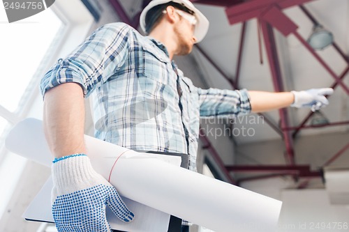 Image of man with blueprint