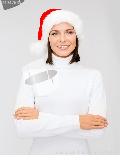 Image of smiling woman in santa helper hat