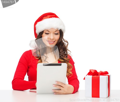 Image of woman with gift box and tablet pc computer