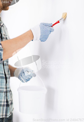 Image of man with paintbrush and pot