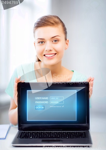 Image of woman with laptop computer and virtual screen