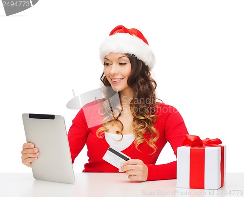 Image of woman with gift, tablet pc and credit card