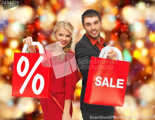 Image of man and woman with shopping bags