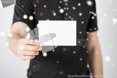 Image of man hand with blank paper