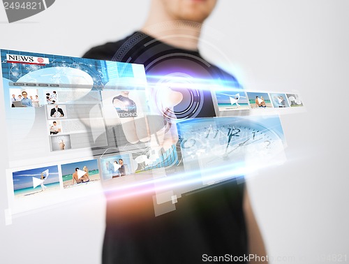 Image of man pressing button on virtual screen