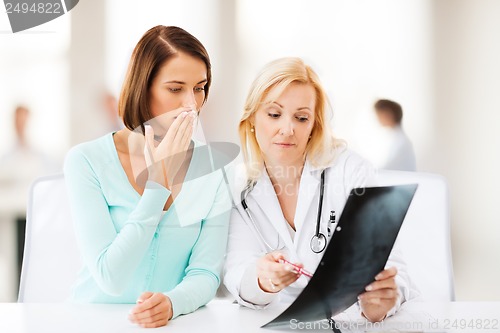 Image of doctor with patient looking at x-ray