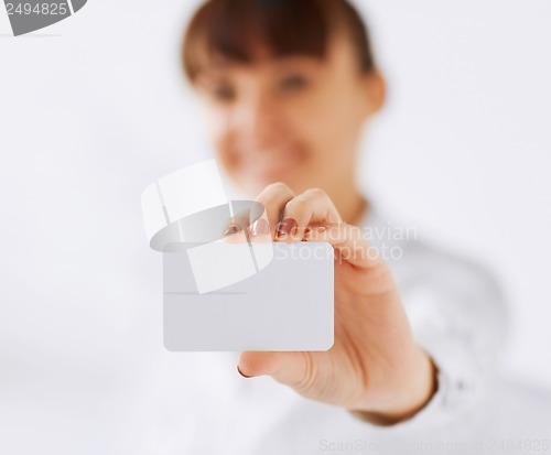 Image of businesswoman showing blank card