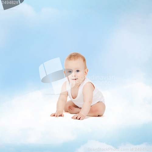 Image of smiling baby sitting on the cloud