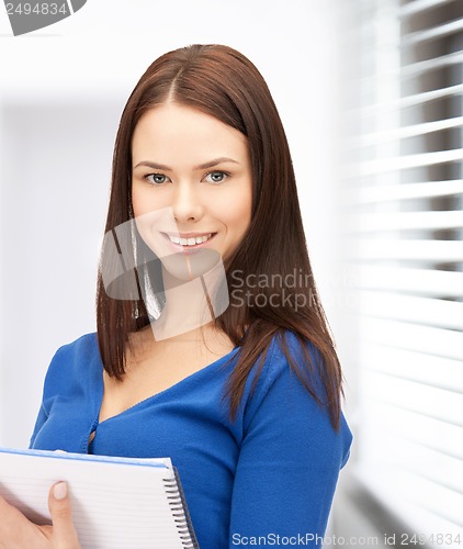 Image of happy woman with big notepad