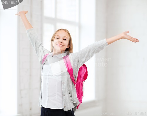 Image of student girl with hands up at school