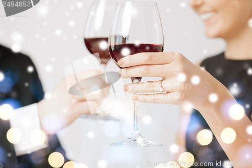 Image of engaged couple with wine glasses