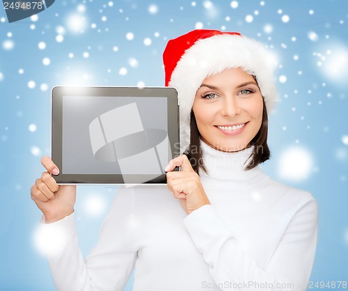 Image of woman in santa helper hat with tablet pc