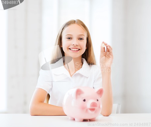 Image of child with piggy bank