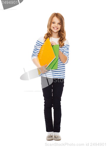 Image of child holding colorful folders