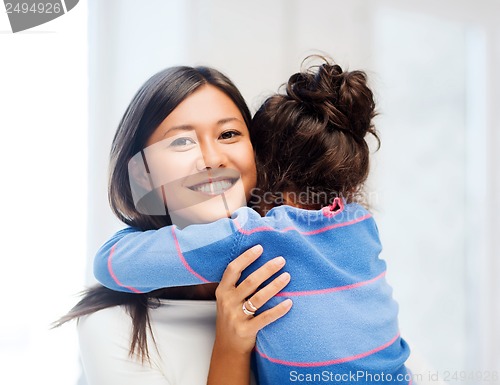 Image of hugging mother and daughter