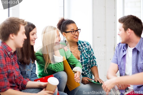 Image of students communicating and laughing at school
