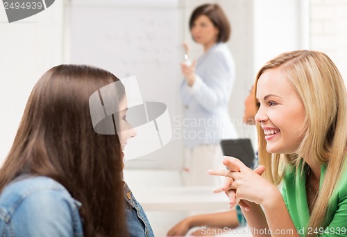 Image of student girls gossiping at school