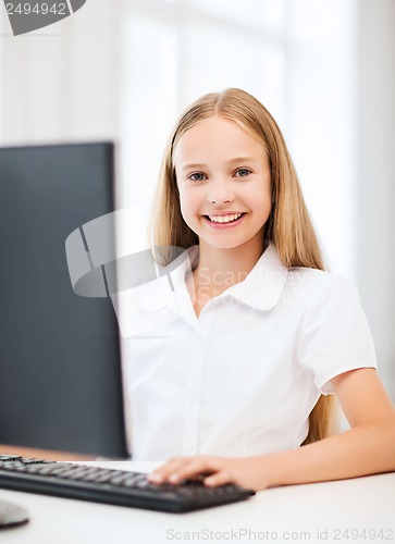 Image of student girl with computer at school