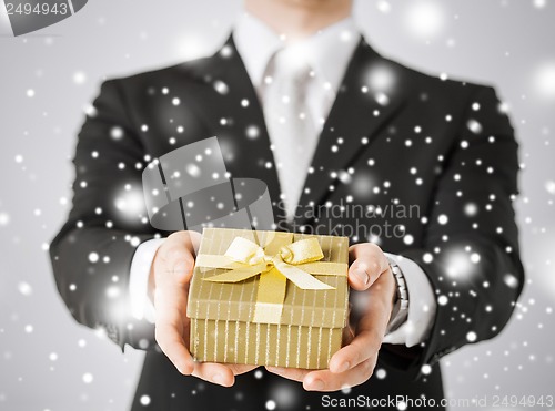 Image of man giving gift box