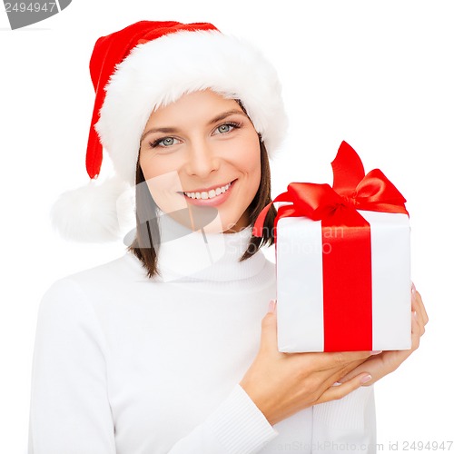 Image of smiling woman in santa helper hat with gift box