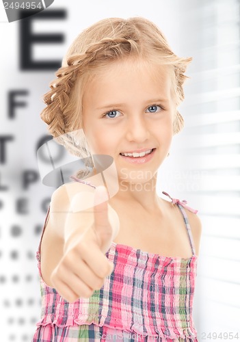 Image of girl with optical eye chart