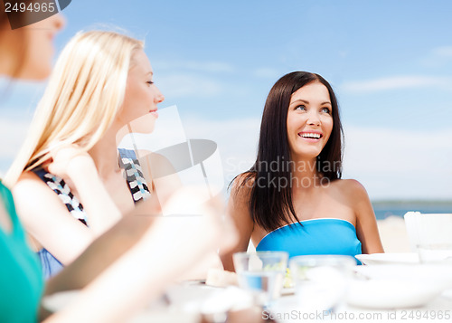 Image of girls in cafe on the beach