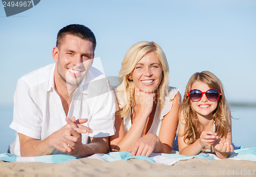 Image of happy family on the beach