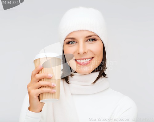 Image of woman in hat with takeaway tea or coffee cup