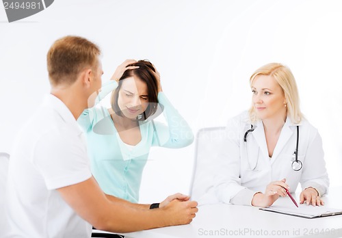 Image of doctor with patients in hospital