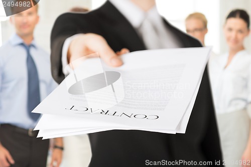 Image of businessman with contract