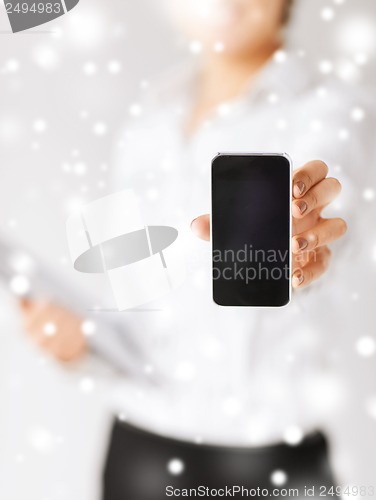 Image of woman hand with smartphone