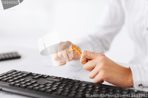 Image of woman breaking pencil