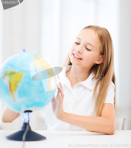 Image of student girl with globe at school