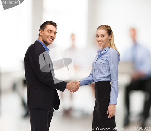 Image of man and woman shaking their hands