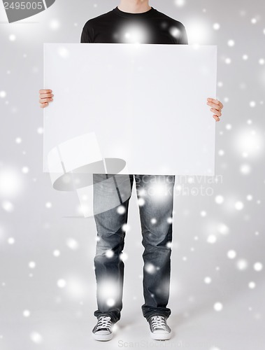 Image of man showing white blank board