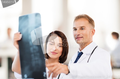 Image of two doctors looking at x-ray