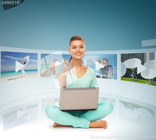 Image of woman with laptop pc and virtual screens