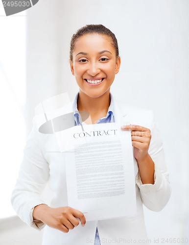 Image of african businesswoman holding contract